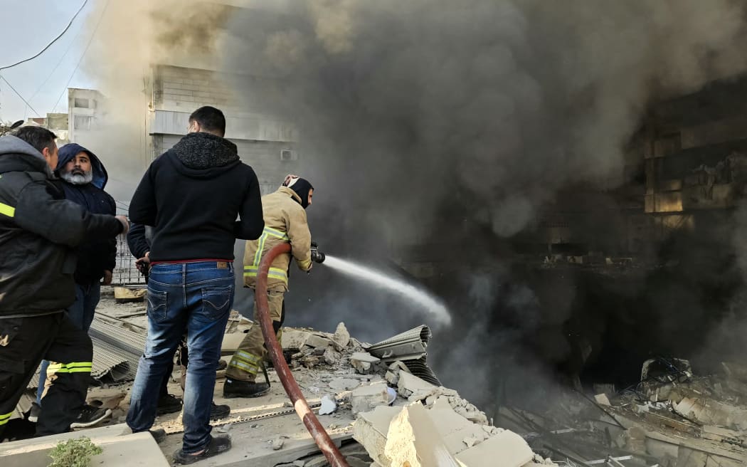 Firefighters extinguish fires at the site of an Israeli airstrike on the southern suburbs of Beirut on March 3, 2026. The Israeli military issued new evacuation orders for dozens of locations in Lebanon on March 3, including warning residents in two southern Beirut neighbourhoods to stay away from several buildings ahead of an imminent operation. (Photo by AFP)