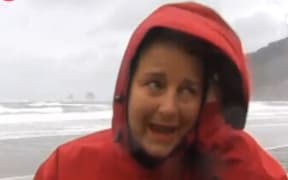 Karen Rutherford in Whangamata struggling to be heard in the storm.