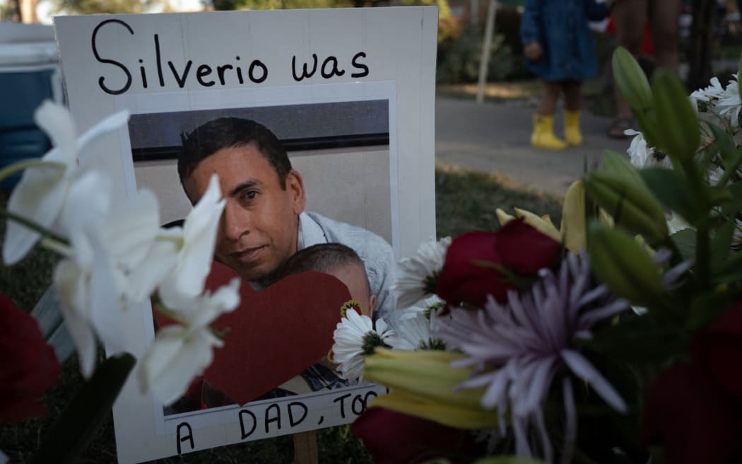 FRANKLIN PARK, ILLINOIS - SEPTEMBER 15: A picture of Silverio Villegas Gonzalez is seen at a memorial located along the street near where he was shot and killed by an Immigration and Customs Enforcement (ICE) agent on September 15, 2025 in Franklin Park, Illinois. Villegas Gonzalez, a single father of two young children, was shot and killed by ICE agents after trying to drive away from a traffic stop on September 12.   Scott Olson/Getty Images/AFP (Photo by SCOTT OLSON / GETTY IMAGES NORTH AMERICA / Getty Images via AFP)