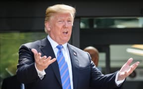 President Donald Trump leaves after holding a press conference ahead of his early departure from the G7 Summit