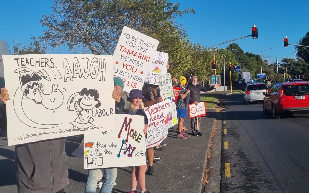 Striking secondary school teachers picketing outside Selwyn College in Auckland on Wednesday, 29 March.