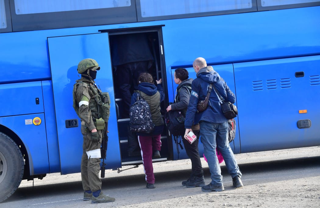 Civilians who were evacuated from the territory of Azovstal steel plant board a bus in Mariupol, Donetsk People's Republic on 6 May 2022.