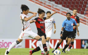Kazuki Nagasawa (right) playing for Japan's Nagoya Grampus battles for the ball with South Korea's Pohang Steelers player Goh Young-jun an AFC Champions League group match in 2021.