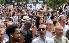 France, Nanterre, June 29, 2023. White march in honor of the mother of Nahel, a 17-year-old boy shot dead by a police officer after refusing to obey a traffic stop in Nanterre. Participants and family demand justice for Nahel . Valerie Dubois / Hans Lucas.
France, Nanterre, le 29 juin 2023. Marche blanche a l’appel de la mere de Nahel, jeune garcon de 17 ans abattu par un policier apres un refus d obtemperer lors d un controle routier a Nanterre. Les participants et la famille demandent justice pour Nahel. . Valerie Dubois / Hans Lucas (Photo by Valerie Dubois / Hans Lucas / Hans Lucas via AFP)