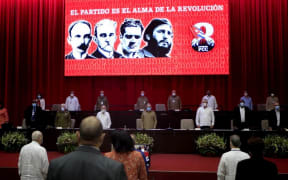 Cuban First Secretary of the Communist Party Raul Castro (C), Cuban President Miguel Diaz-Canel (3-R) and other memebrs under a screen