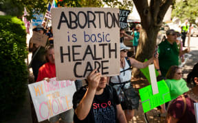 A pro-choice demonstrator considers abortion to be health care during a demonstration outside Senate office buildings on Capitol Hill. Protesters demanded Democrats take action to restore reproductive rights. Protests erupted across the United States immediately after the Supreme Court issued its opinion on Dobbs v. JWHO, . reversing the federal right to abortion decided in Roe v. Wade. Without Congressional action, each state tmay set its own laws, and 26 have or are expected to ban abortion completely. (Photo by Allison Bailey/NurPhoto)
Allison Bailey / NurPhoto / NurPhoto via AFP