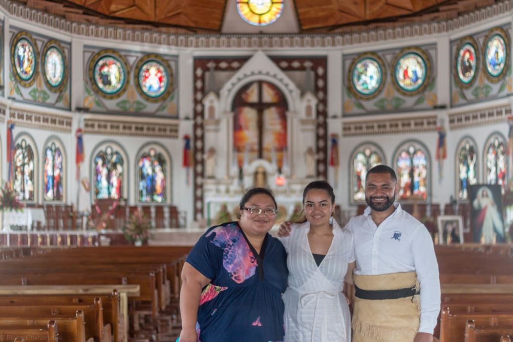 From left to right: Koreti Tiumalu, Brianna Fruean, and Joseph Sikulu at the Mulivai Catholic Cathedral in Apia, Samoa.