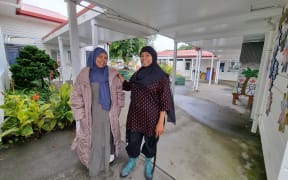Fadumo Ahmed (left) and Asya Mohamed Abeid from the New Zealand Women's Ethnic Trust, at May Road School which has opened its doors to shelter migrants and Muslims during the Auckland floods.
