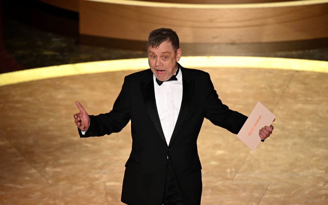 US actor Mark Hamill presents the award for Best Original Score onstage during the 97th Annual Academy Awards at the Dolby Theatre in Hollywood, California on March 2, 2025. (Photo by Patrick T. Fallon / AFP)