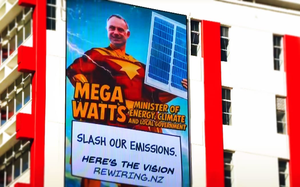 A strategically-placed billboard that was part of a lobbying campaign targeting energy minister Simon Watts, caputured by TVNZ's Q+A.