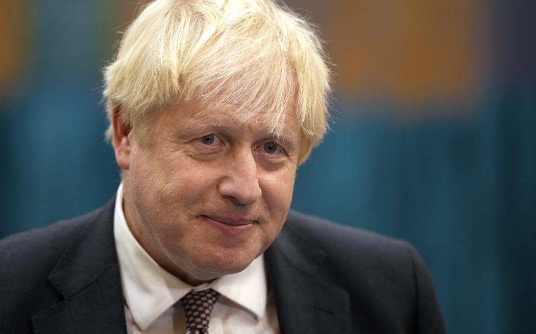 Britain's Prime Minister Boris Johnson speaks to the media as he visits a Covid-19 vaccination centre at Little Venice Sports Centre in London on October 22, 2021.
