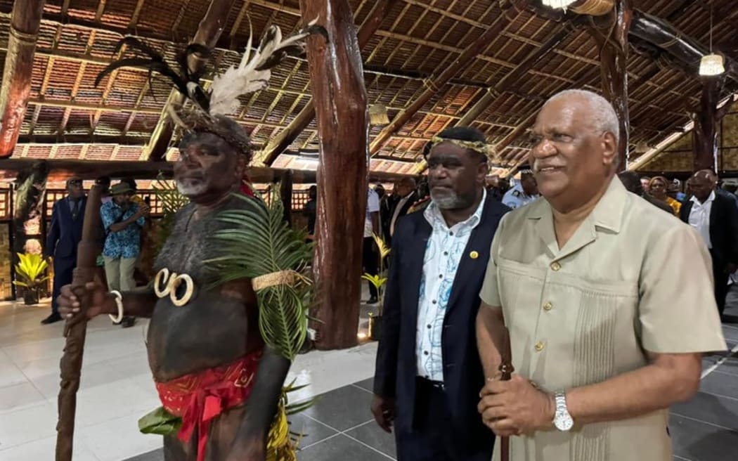 President of the Malvatumauri council of chiefs Ravun Merhimba DangDang (left), Minister of Finance Johnny Koanapo (center) and President, Nikenike Vurobaravu (right) tour the new nakamal. Pictured on Mar. 5, 2025.