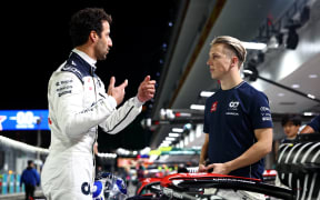 Daniel Ricciardo of Australia and Scuderia AlphaTauri and Liam Lawson of New Zealand and Scuderia AlphaTauri during the 2023 F1 Grand Prix of Las Vegas.