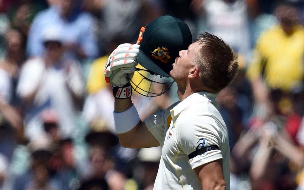David Warner celebrates his century during the first test against India in Adelaide.
