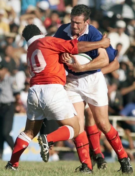 Alexandre Chazalet runs into Tonga's Elisi Vunipola during their 1999 test match in Nuku'alofa. Tonga won 20-15.