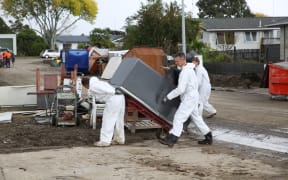More than 200 people were bussed in each day over the weekend to help clean up.