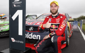 Shane van Gisbergen celebrates race victory.