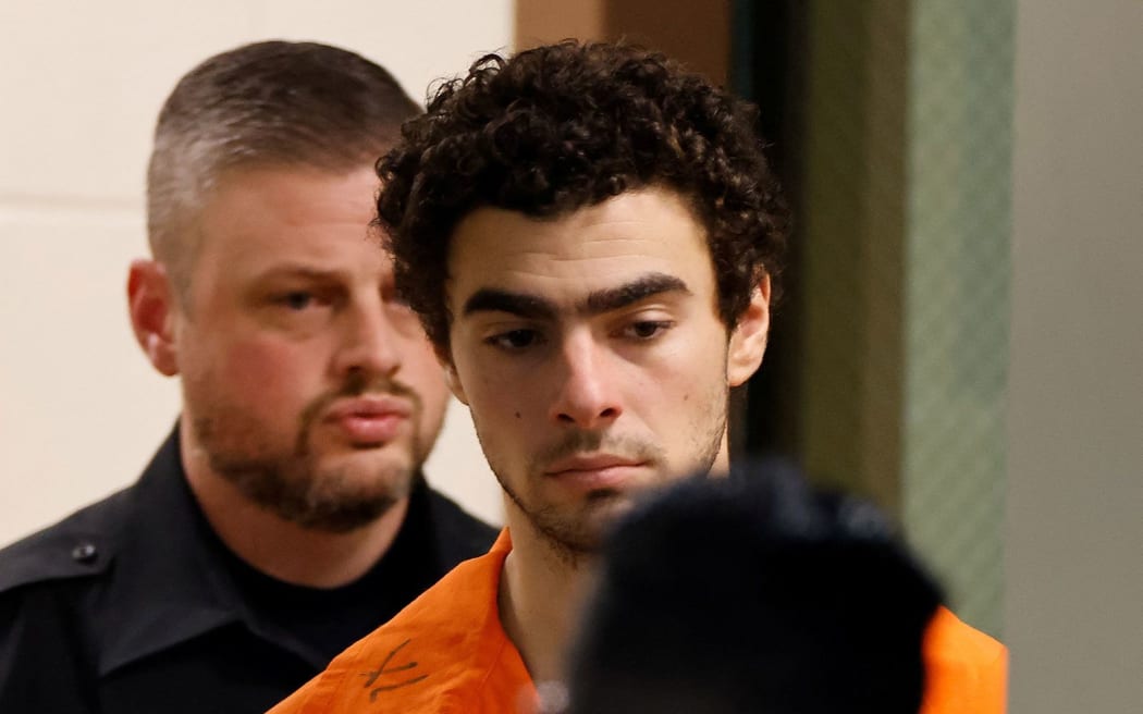 Luigi Mangione is escorted from the Blair County Court House in Hollidaysburg, Pennsylvania, after an extradition hearing on Tuesday.