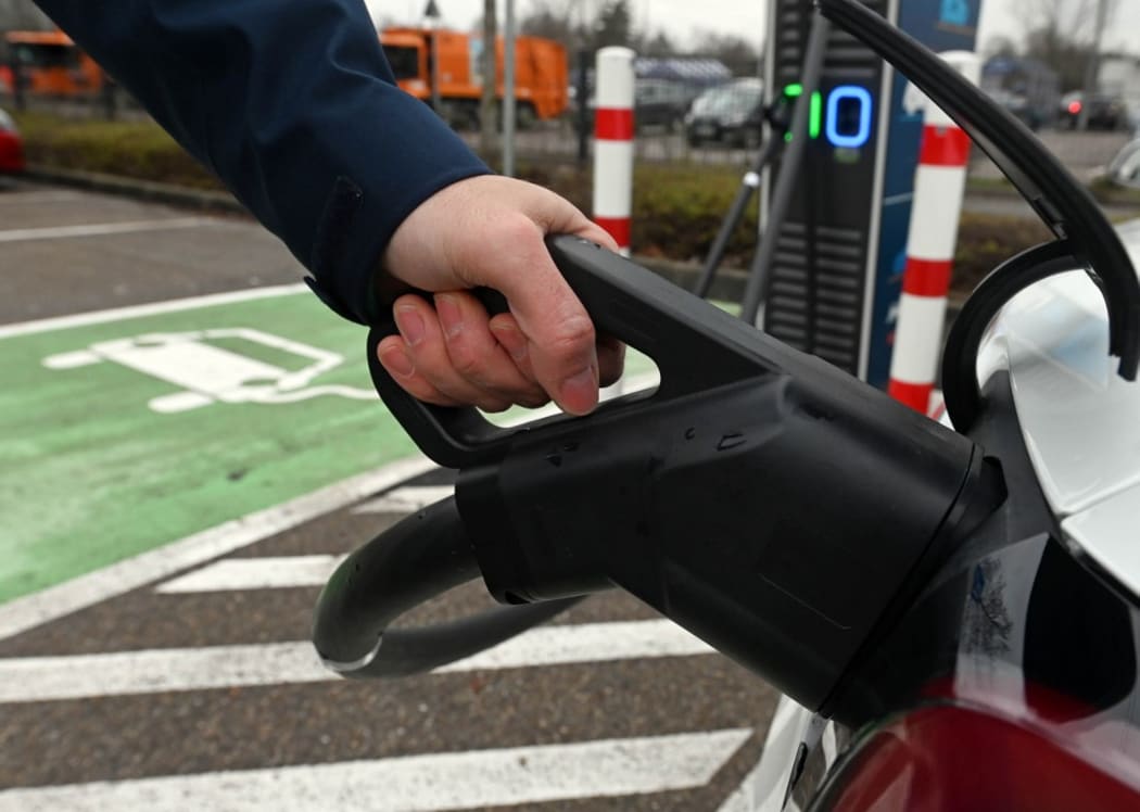 A car is charged in a fast-charging park for e-cars.