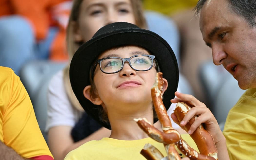 A Romania fan looks on during the UEFA Euro 2024 round of 16 football match between Romania and the Netherlands at the Munich Football Arena in Munich on July 2, 2024. (Photo by MIGUEL MEDINA / AFP)