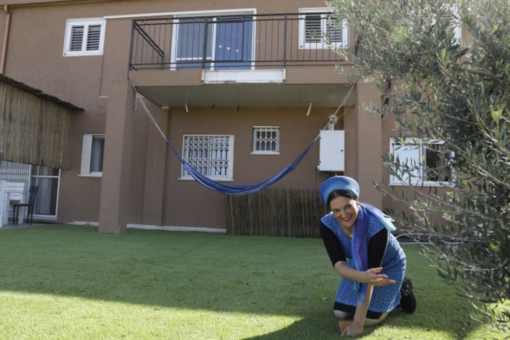 Moria Shapira, Airbnb's apartment owner outside her apartment in Adei Ad outpost north of the Palestinian village of al-Mughayyir, near the occupied West Bank city of Ramallah on November 20 2018. Airbnb said that it will remove such listings from its website. (Photo by MENAHEM KAHANA / AFP)