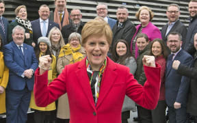 Scottish National Party (SNP) leader and Scotland's First Minister Nicola Sturgeon poses with SNP's newly elected MPs, Dundee, 14 December.
