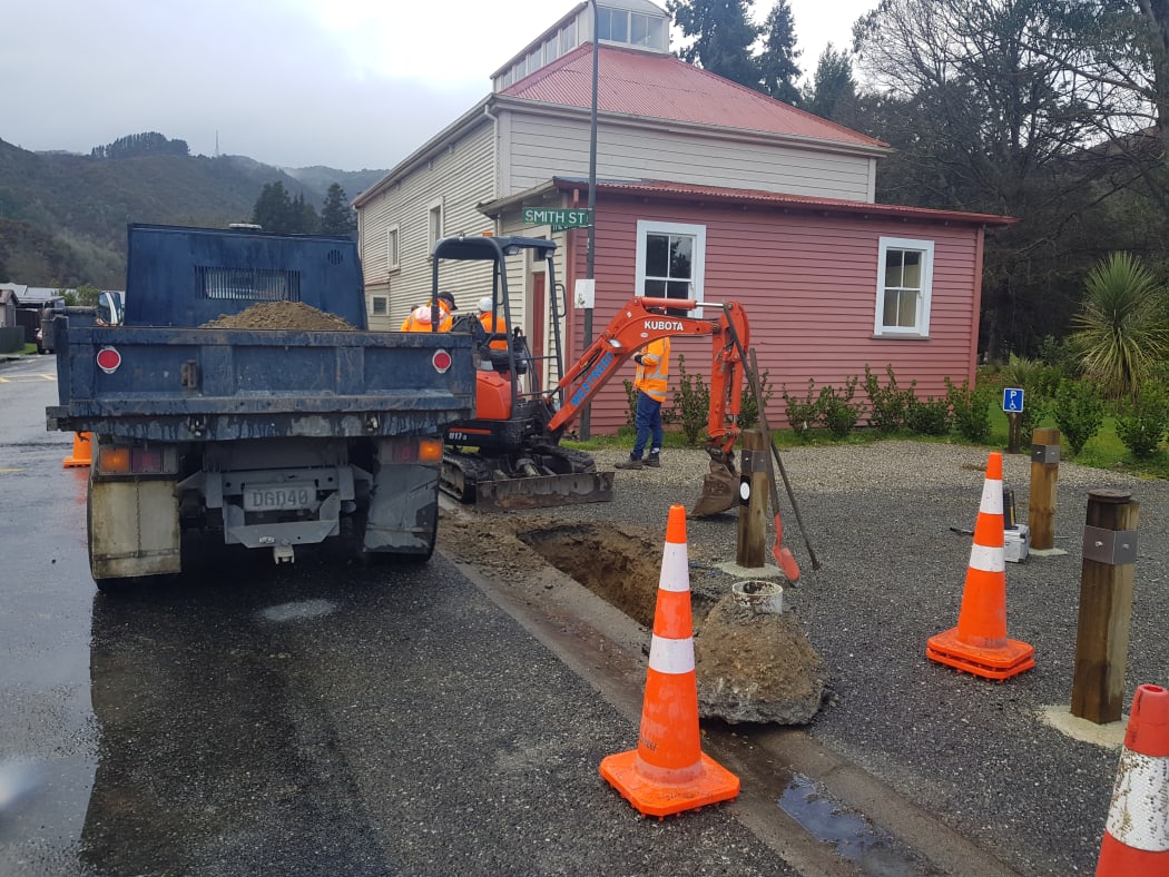 The scene outside Reefton's band hall today as Detection Services and council staff test a leaky pipe.