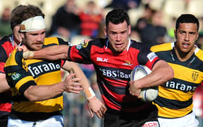 Canterbury's Ryan Crotty fends off Berny Hall of Taranaki during the ITM Cup rugby match, Canterbury v Taranaki, at AMI Stadium, Christchurch, on the 27th September 2015. Copyright Photo: John Davidson / www.photosport.nz