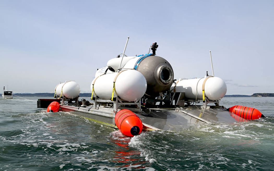 This undated image courtesy of OceanGate Expeditions, shows their Titan submersible being towed to a dive location in Everett, Washington. Rescue teams expanded their search underwater on June 20, 2023, as they raced against time to find a Titan deep-diving tourist submersible that went missing near the wreck of the Titanic with five people on board and limited oxygen. All communication was lost with the 21-foot (6.5-meter) Titan craft during a descent June 18 to the Titanic, which sits at a depth of crushing pressure more than two miles (nearly four kilometers) below the surface of the North Atlantic.