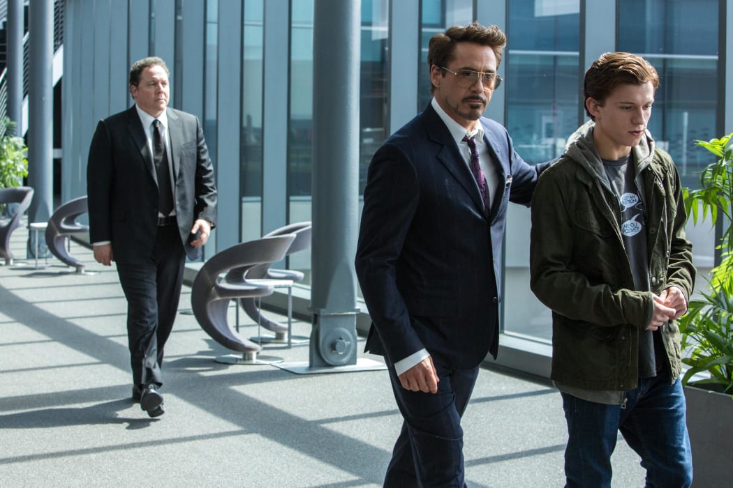 Original director of Iron Man, Jon Favreau (left), is the only member of the team who can devote more than a day on set to Spider-Man: Homecoming so he gets more to do. Downey Jr.? Not so much.