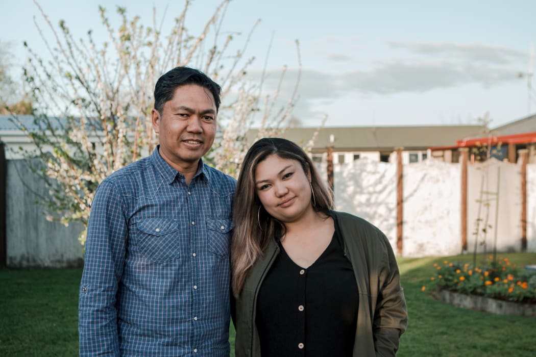 Alfredo Bernal and daughter Donally in Alfredo's garden in Kirikiriroa