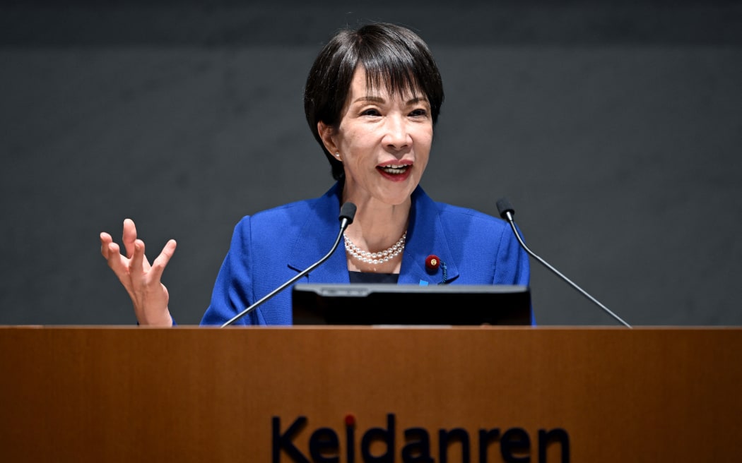 Japan's Prime Minister Sanae Takaichi delivers a speech at the 14th Council Meeting of the Japan Business Federation, or Keidanren, in Tokyo on December 25, 2025. (Photo by Kazuhiro NOGI / AFP)