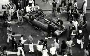 Car overturned by rioters
