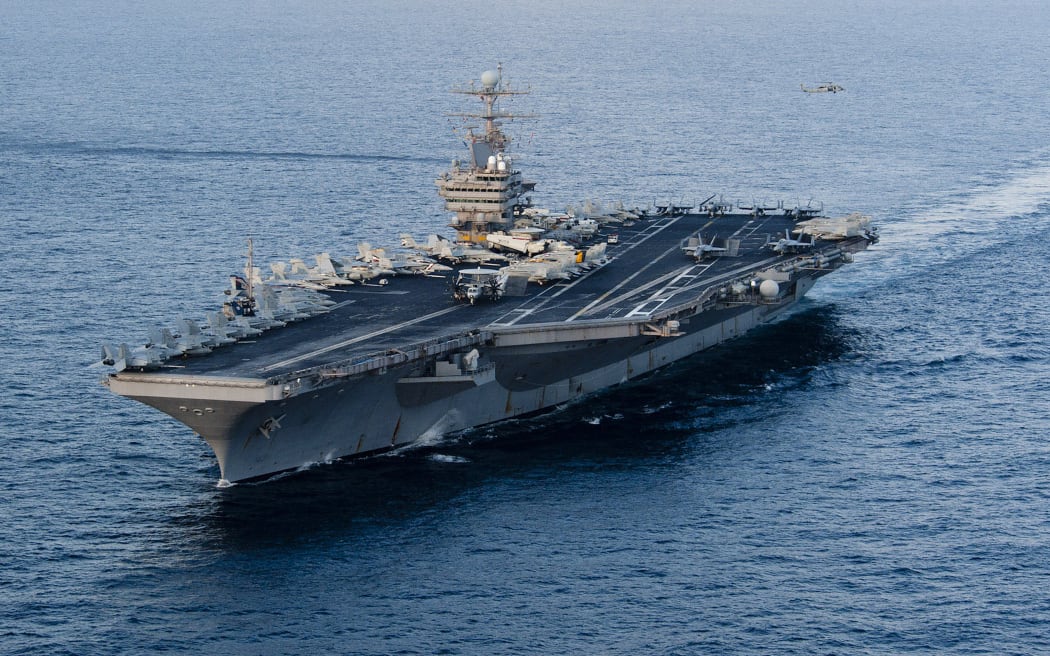 (FILES) This January 19, 2012 image provided by the US Navy, shows the Nimitz-class aircraft carrier USS Abraham Lincoln transiting the Arabian Sea. - The US will bolster its military presence in the Middle East, deploying additional warships and fighter jets to protect US personnel and defend Israel amid soaring tensions in the region, the Pentagon said on August 2, 2024. The aircraft carrier strike group led by the USS Abraham Lincoln will replace one helmed by the USS Theodore Roosevelt in the region, deputy Pentagon Press Secretary Sabrina Singh said. (Photo by Will Tyndall / US NAVY / AFP) / RESTRICTED TO EDITORIAL USE - MANDATORY CREDIT "AFP PHOTO / US NAVY/MASS COMMUNICATION SPECIALIST 3RD CLASS/WILL TYNDALL " - NO MARKETING NO ADVERTISING CAMPAIGNS - DISTRIBUTED AS A SERVICE TO CLIENTS