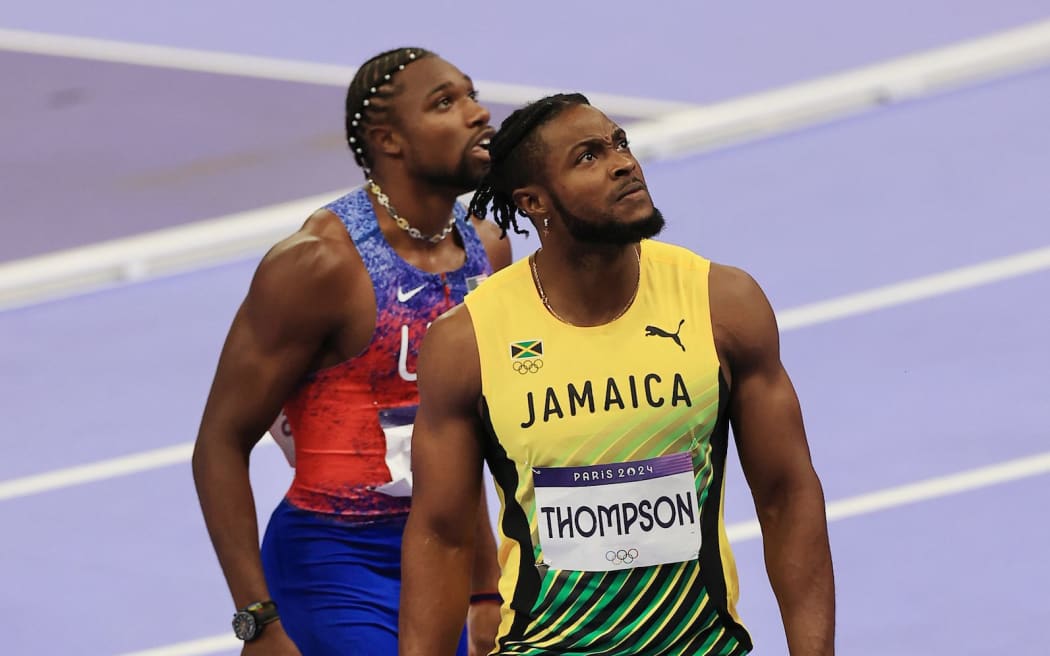 Kishane Thompson (JAM) and Noah Lyles (USA) look on after the Men's 100m Final at Stade de France during the 2024 Paris Olympics - Paris, France on Sunday 04 August 2024. (Photo: Simon Stacpoole / www.photosport.nz)