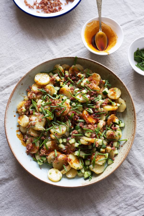 A big bowl of colourful potato salad.