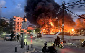 A blaze sweeps following Israeli bombardment on a solar farm and electricity generation facility in Lebanon's southern coastal city of Tyre on March 4, 2026. Israeli forces on March 4 advanced into a number of towns and villages in south Lebanon, a source from the UN peacekeeping force in the country, UNIFIL, told AFP. (Photo by Kawnat HAJU / AFP)