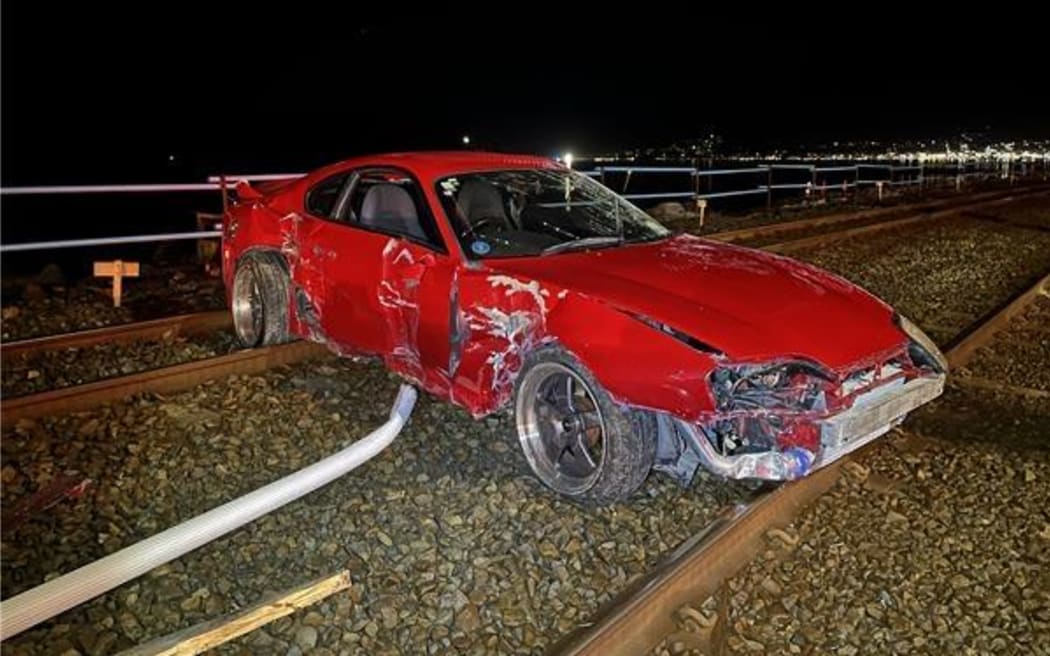 The vehicle from one of the gatherings that crashed through a metal barrier onto railways off State Highway 2.