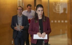 Prime Minister Jacinda Ardern and Director-General of Health Dr Ashley Bloomfield arriving for their Covid-19 update media conference at Parliament, Wellington, on Day 33 of the Covid-19 coronavirus lockdown. 27 April, 2020.