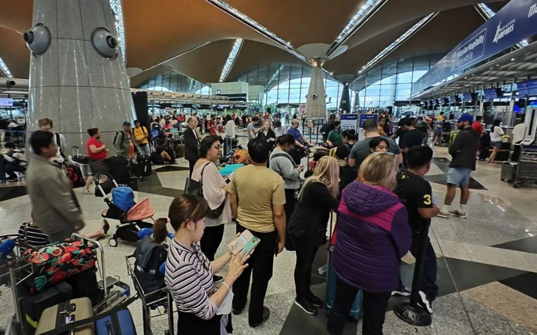 Queues at Kuala Lumpur Airport as a result of the flooding at Auckland Airport on Friday, 27 January.
