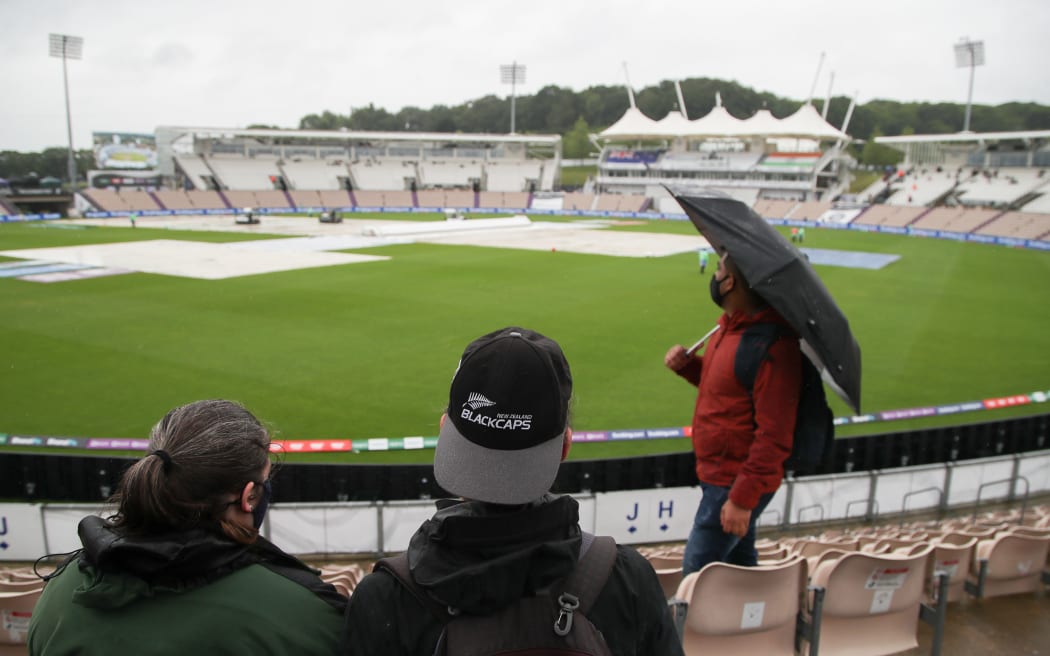 New Zealand Black Caps fans look out over the wet Hampshire Bowl ground.