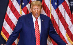 Former US President and Republican presidential hopeful Donald Trump arrives for a "Commit to Caucus" rally in Clinton, Iowa, on January 6, 2024. (Photo by TANNEN MAURY / AFP)