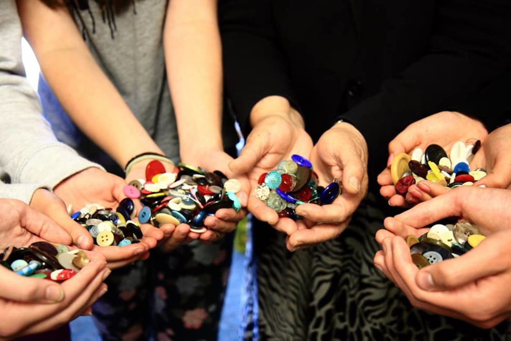 Buttons for the Children's Holocaust Memorial serving as a reminder to stand up against prejudice discrimination and apathy.