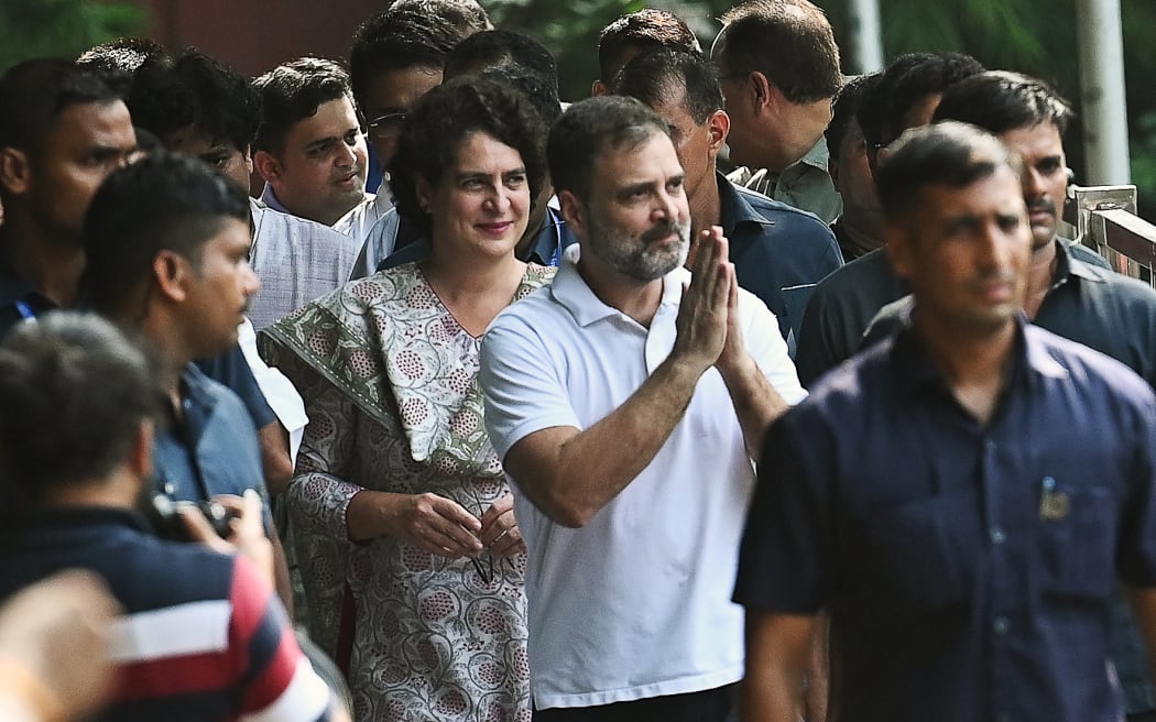 Congress party leader Rahul Gandhi (in white) with Priyanka Gandhi Vadra at the party headquarters in New Delhi on 4 August, 2023, after the Supreme Court suspended his defamation conviction.