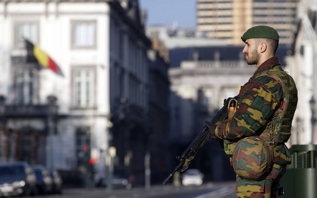 A Belgian soldier stands guard outside the US Embassy in Brussels on 17 January.