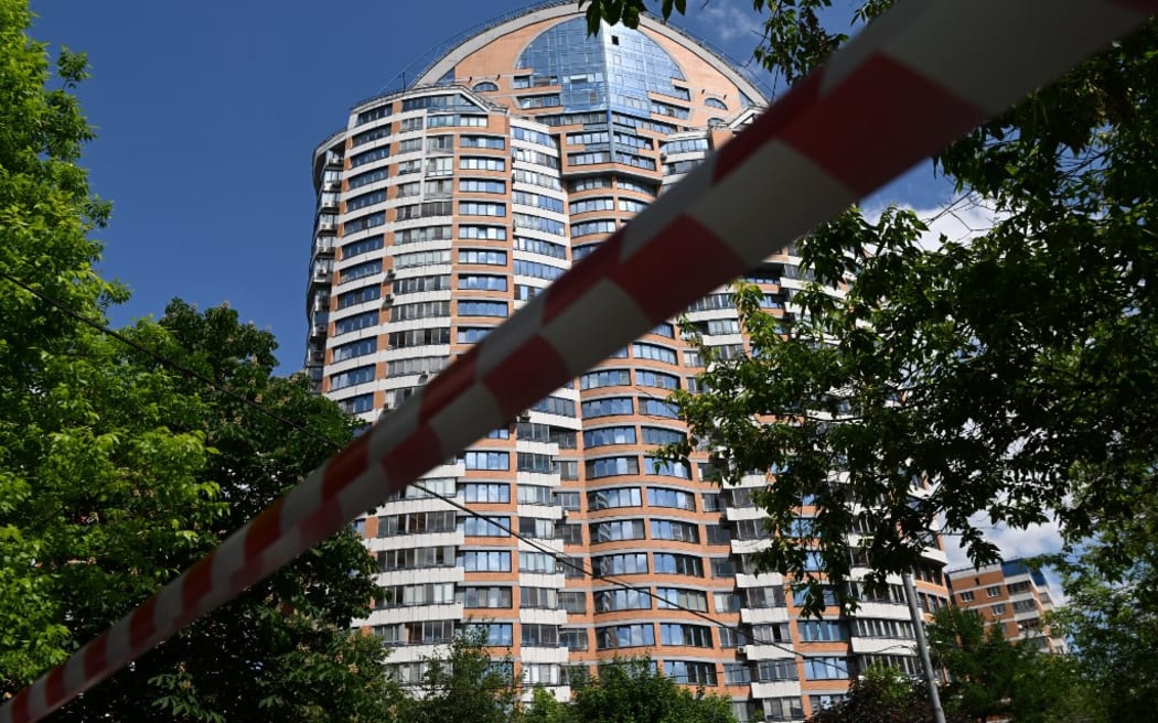 Police tape blocks an area outside a multi-storey apartment building after a reported drone attack in Moscow on May 30, 2023. (Photo by Kirill KUDRYAVTSEV / AFP)