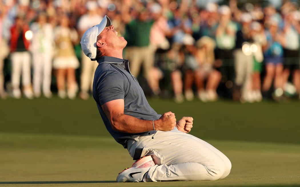 AUGUSTA, GEORGIA - APRIL 13: Rory McIlroy of Northern Ireland celebrates winning the 2025 Masters Tournament after the first playoff hole on the 18th green at Augusta National Golf Club on April 13, 2025 in Augusta, Georgia.   Richard Heathcote/Getty Images/AFP (Photo by Richard HEATHCOTE / GETTY IMAGES NORTH AMERICA / Getty Images via AFP)