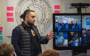 Mental health worker Lamon Paranihi-Haami explains aspects of new mental health and addictions service Te Korowaitia Te Puna Waiora to Associate Health Minister Peeni Henare.