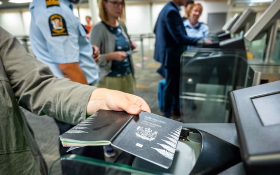 Person using an eGate at an airport.