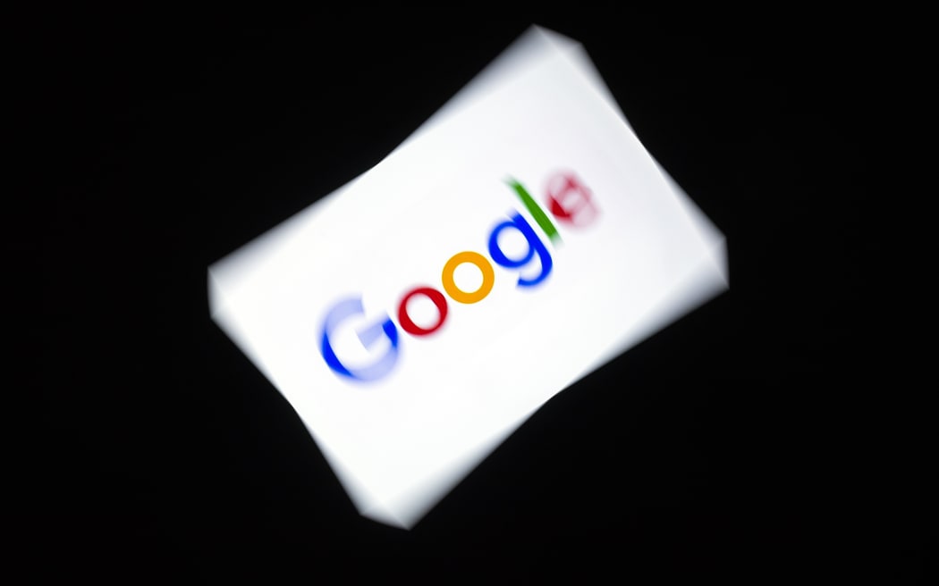 This illustration picture shows the Google logo displayed on a tablet